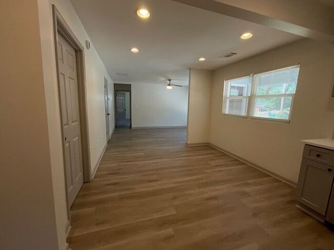 Building Photo - **Spacious 4BR with Modern Upgrades & Cove...
