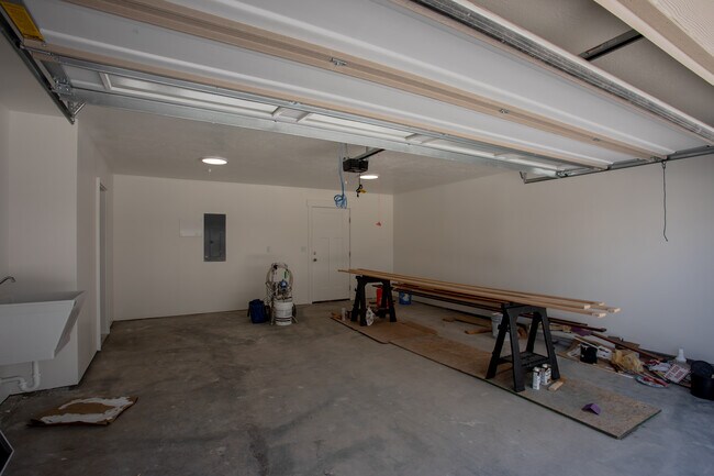 Two car garage with laundry room and utility sink. - 361 W Reed Ave