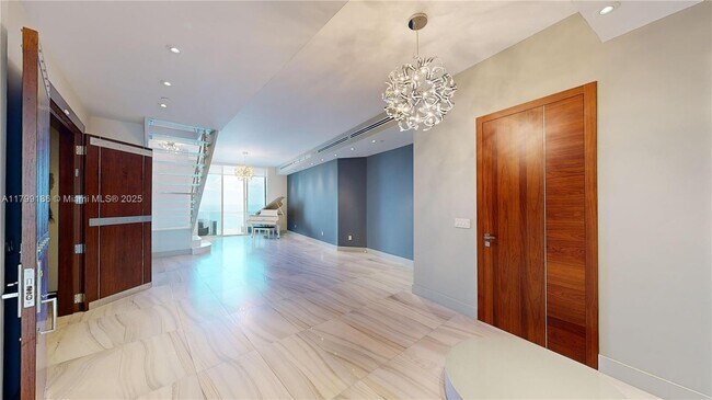 Building Photo - 18201 Collins Ave