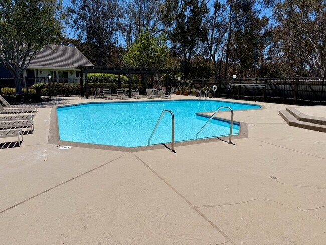 Building Photo - Private Oasis with Sunroom, Balcony & Lush Landscaping | 4BR Home Near Community Pool & Spa