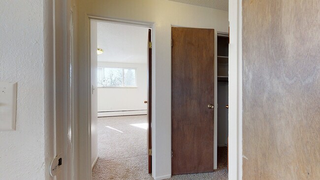 Step into this inviting space filled with natural light. - Harmony Apartments