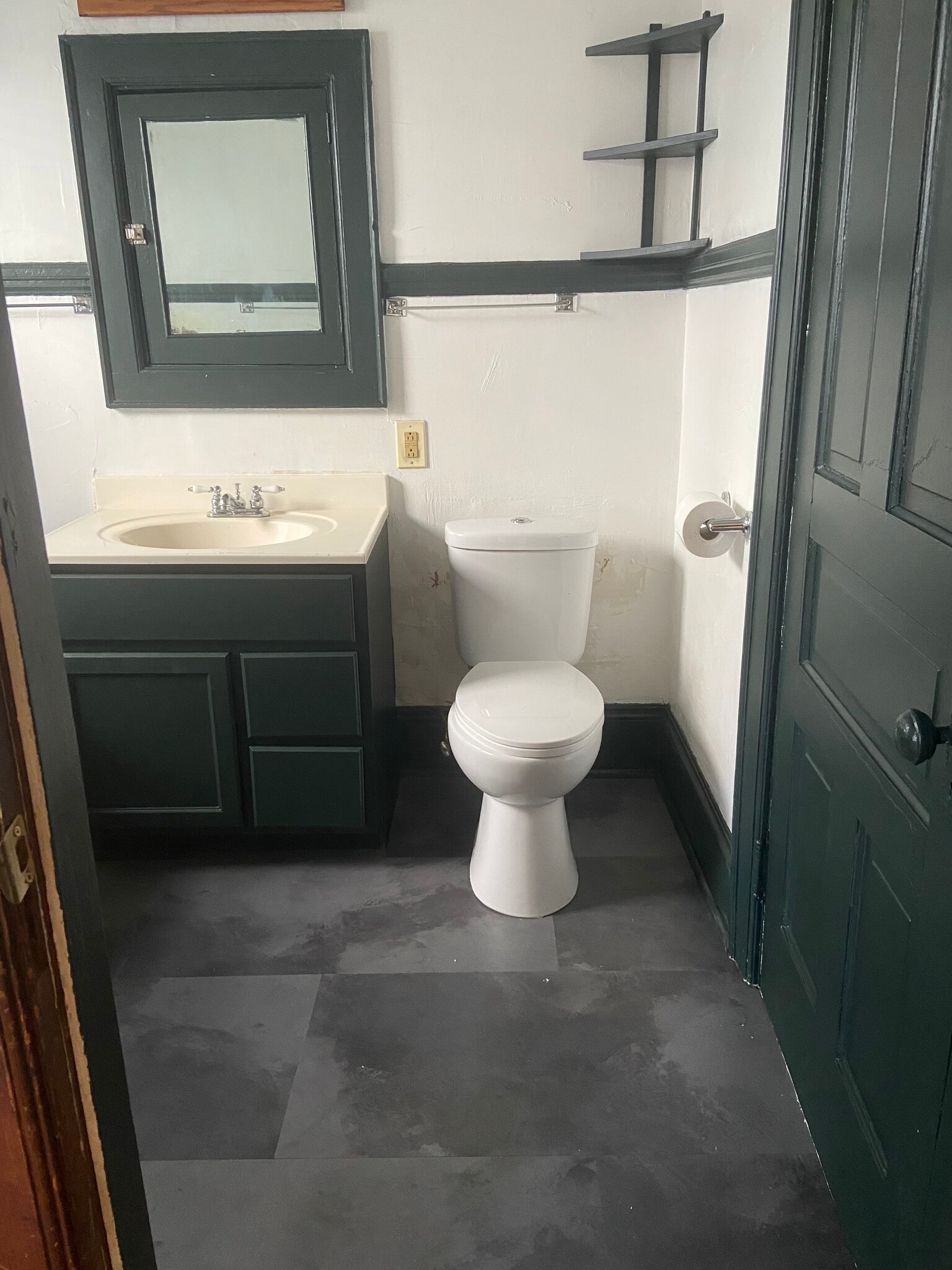 New tile & water efficient toilet - 811 E Hadley St