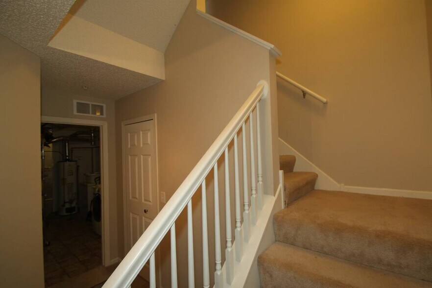 Stairs from ground floor up to main level - 3843 Abercrombie Ln