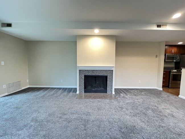 Building Photo - Ground Floor End Unit on Jantzen Beach with River Views & Flexible Living Space