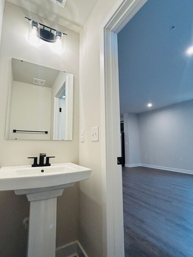 Building Photo - New Construction • 4 BR • 2 Full / 2 Half BA • End Unit Townhome in Village Town – Fayetteville’s...