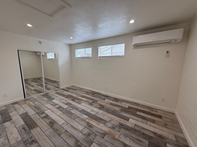 Building Photo - 4 Bedroom Home with Large Backyard | Modern Landscaping | Utilities Included