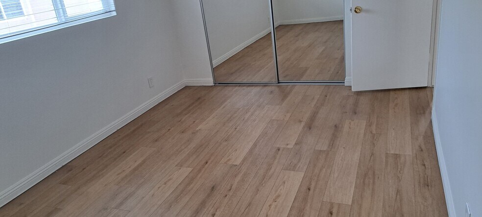 BEDROOM 2 WITH MIRRORED WARDROBE DOORS AND EXTRLARGE EAST FACING WINDOW - 314 20th St
