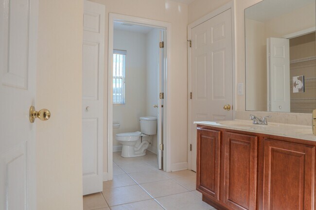 Building Photo - Spacious 5BR Home in Falcon Trace | 3-Car Garage | Screened Patio | Resort-Style Amenities Rent: ...