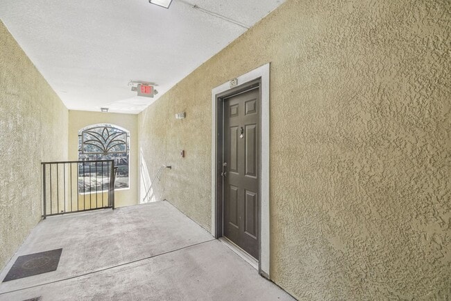 Building Photo - Elegant 1-Bedroom Condo with Lakeside Views in Resort-Style Community