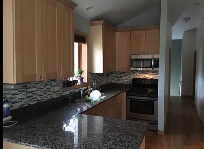 Bright kitchen with window lets in natural light. - 419 W Root St