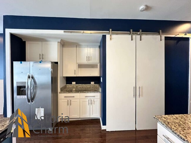 Building Photo - Beautifully Renovated 3BR Rowhome Near Johns Hopkins – Gated Parking + Modern Upgrades