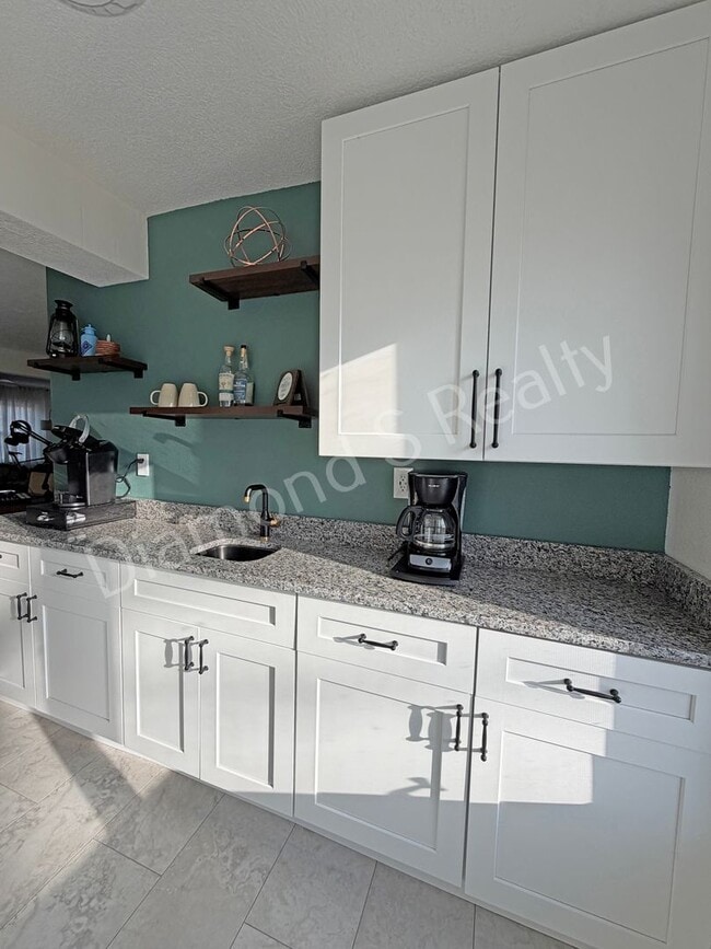 Building Photo - Stunning 3_Bed Home with Two Primary Suites & a Pool!