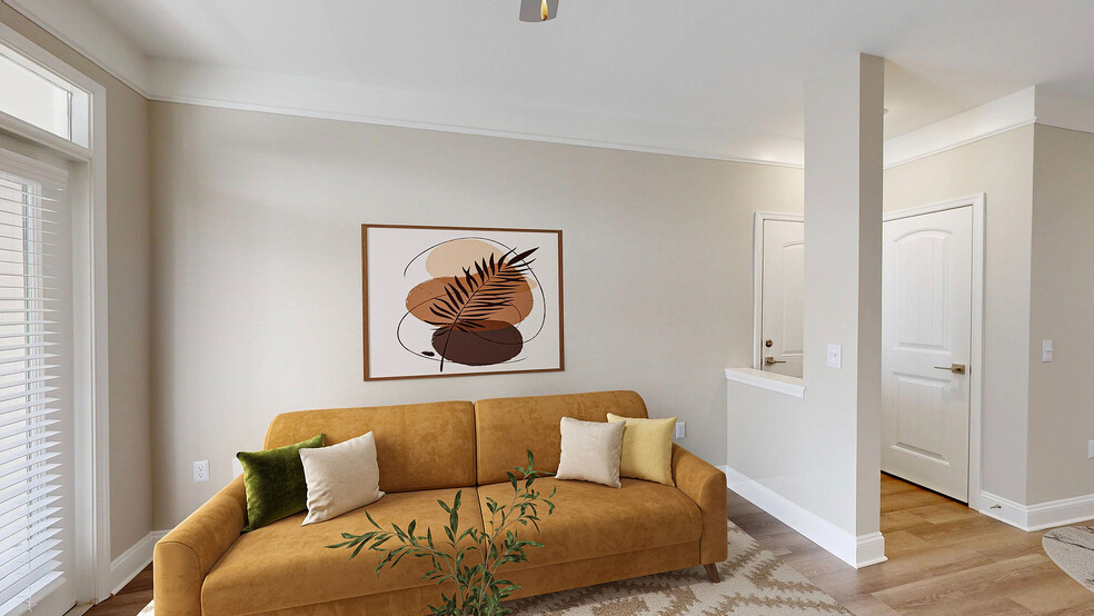 Newly Renovated Living Room with Hardwood-Style Flooring - Creekstone at RTP Apartments