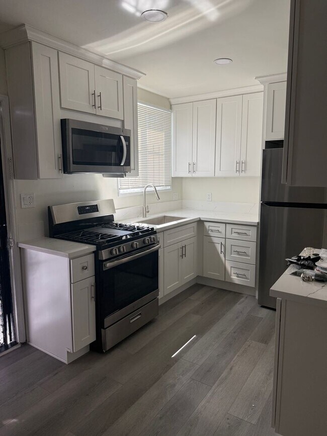 Building Photo - FOR RENT — COMPLETELY REMODELED Apartment