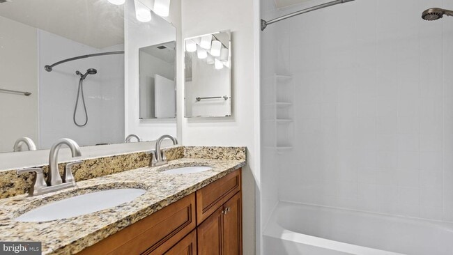 Building Photo - This stunning 3-bedroom, 2-bathroom interior townhome is sure to impress.