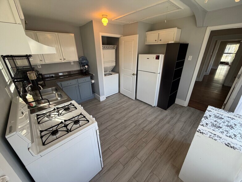 Bright, open kitchen, with W/D in closet. - 2485 Harvard Ave