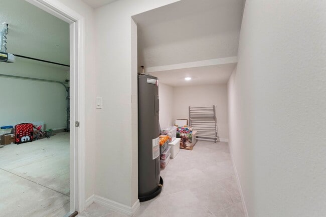 Building Photo - Introducing a captivating 3-story townhome...