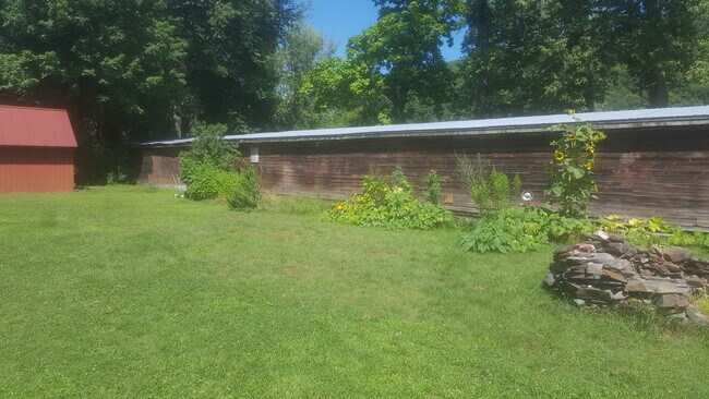 Backyard with Raised Beds - 53 River St