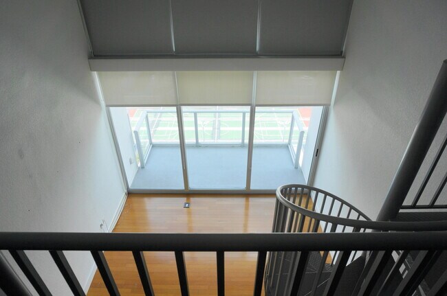 Building Photo - Large 1 Bed Loft with 20 Foot Wall of Glass City View at The VUE!