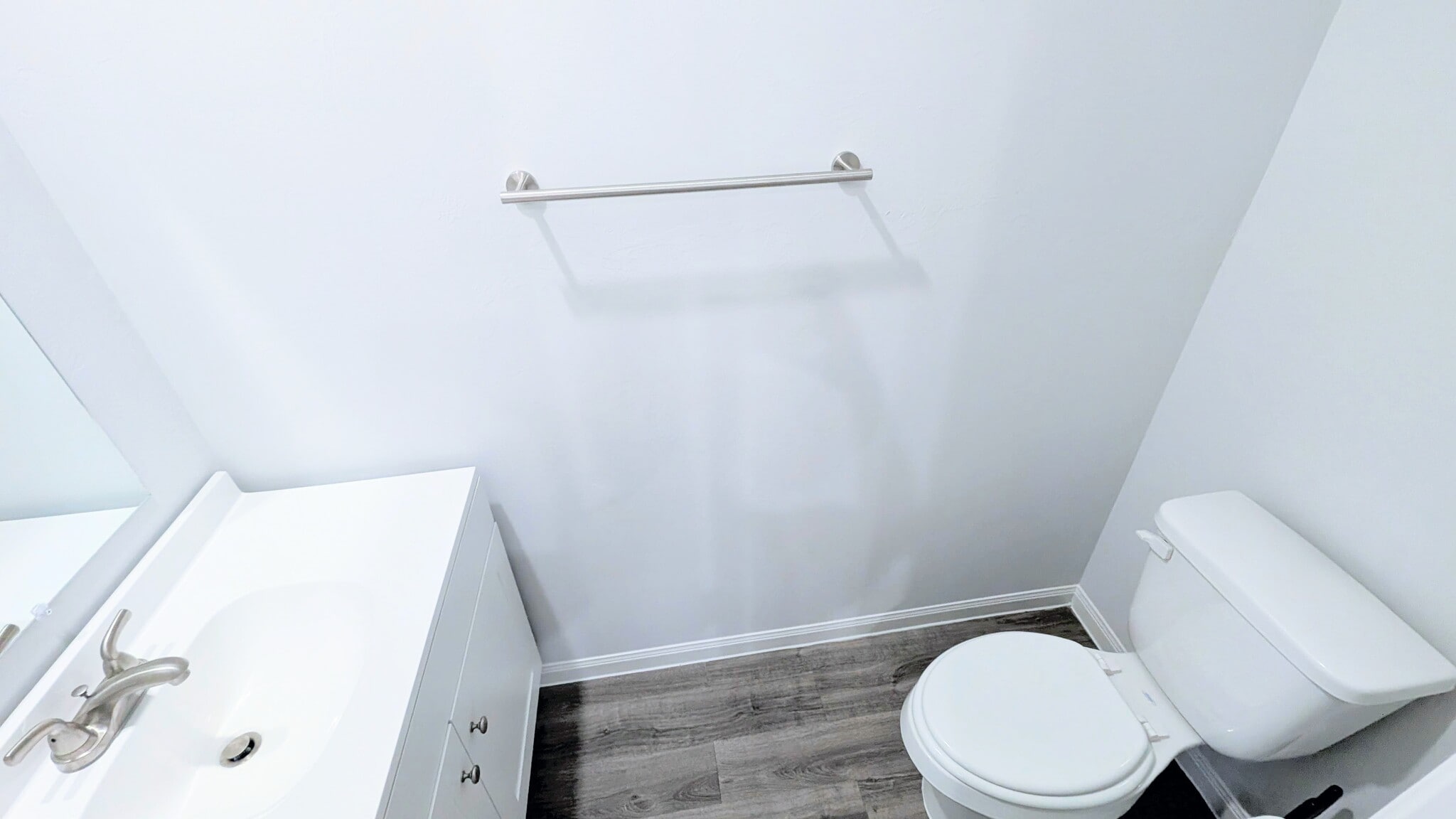 Spacious half bath located off of the main living area. - 13218 HP Johnson St