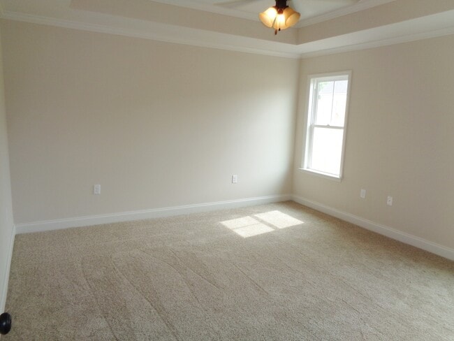 Building Photo - Spacious 4BR Home with Open Split Floor Plan, Granite Kitchen & Fenced Yard