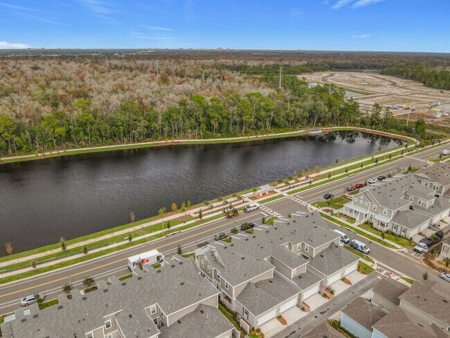 Building Photo - New Luxury Townhome in Celebration, FL Corner unit. All porcelain tiled floors. Aleutian model by...