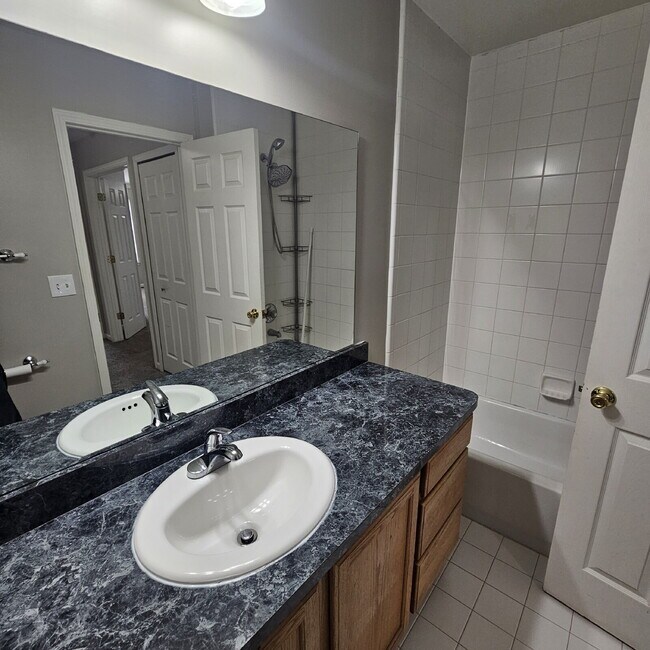 Building Photo - 2 Bedroom, 1.5 Bath Townhouse w/ Garage & Huge Master Bedroom. Full Sized Washer & Dryer In Unit.
