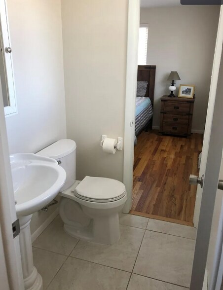 Powder bathroom with access from bedroom and kitchen - 6482 Zephyr St