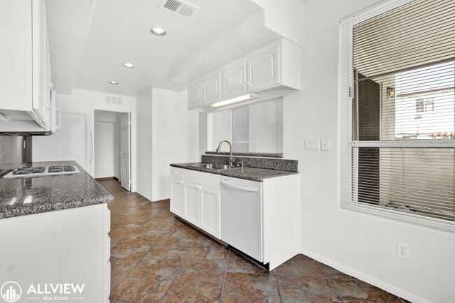 Building Photo - Spacious Coastal Condo with Rooftop Ocean ...