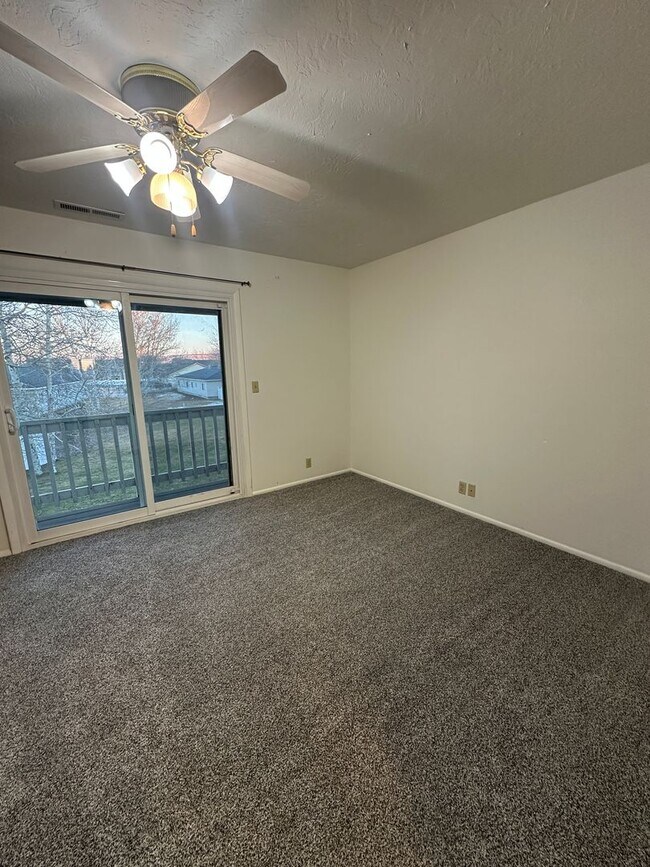 Building Photo - Spacious, three level, 4 Bed 2.5 bath Townhome in Ammon right behind the Walmart on Hitt.