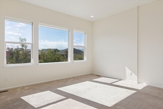 Building Photo - Modern 4-Bed Ranch in Erie with 13-Ft Ceilings, Solar Panels & EV Charger