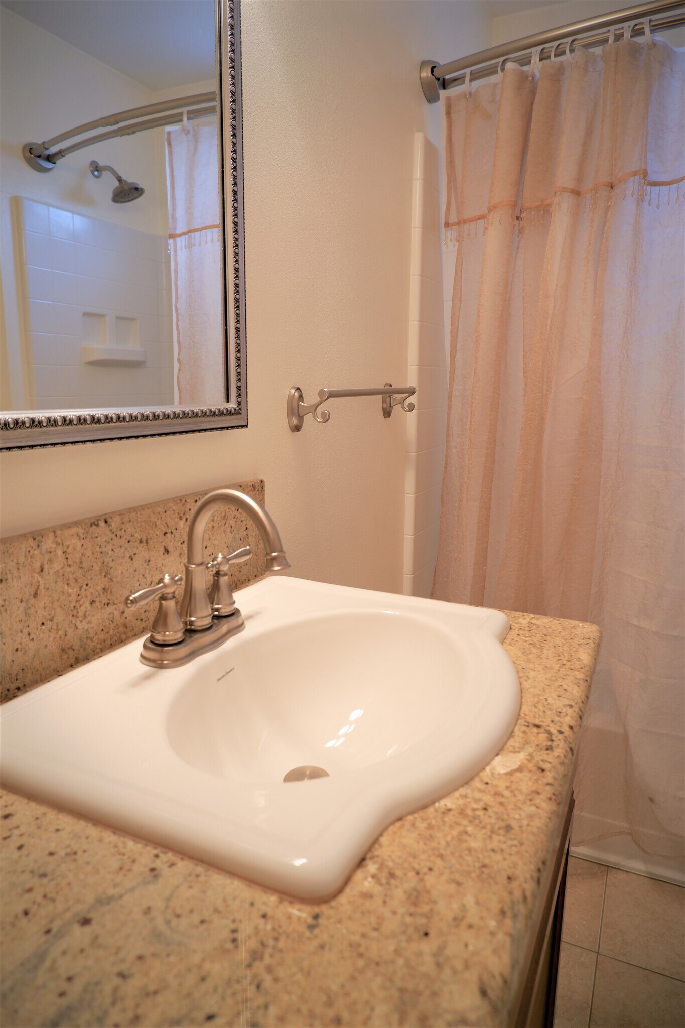 Granite countertop with updated sink and medicine cabinet! - 3517 E 32nd Ave