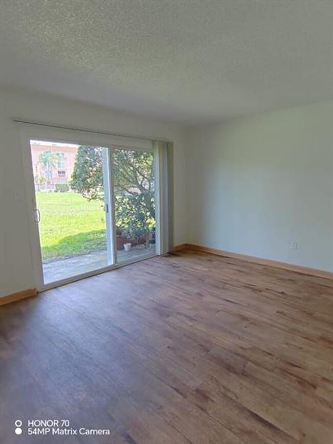 Building Photo - Welcome to Tampa Racquet Club – Where Comfort Meets Convenience!