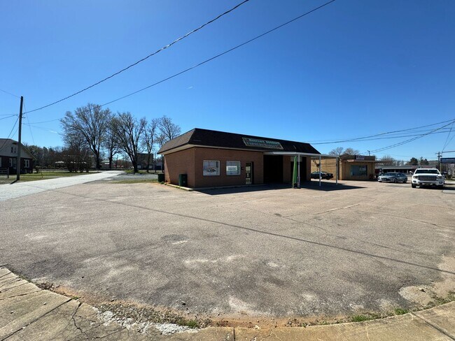 Building Photo - Prime Commercial Space for Rent in Downtown Granite Quarry - 1,323 Sq Ft with Bay Doors