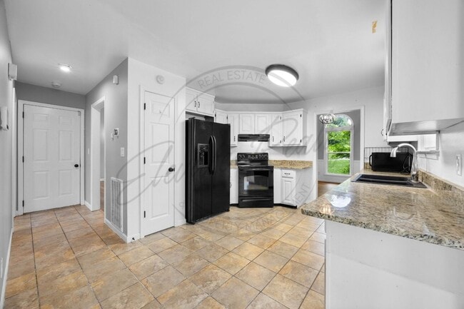 Building Photo - Four Bedroom Two Story with Two Car Garage...