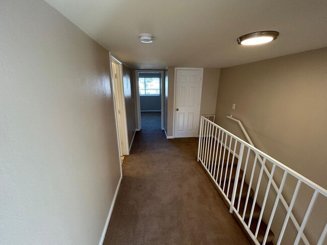 Building Photo - 2 Bedroom 1.5 Bath Townhome. Gated Community. Upgraded & 2 Parking Spaces