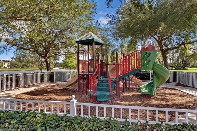 Building Photo - Spacious 3-Bedroom 2 Bath Villa with 2-Car Garage Steps from the Resident Gate in the Prestigious...
