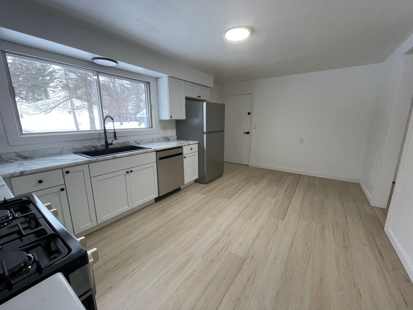 Modern kitchen featuring stainless steel appliances and plenty of cabinet storage. - 1310 21st Ave S