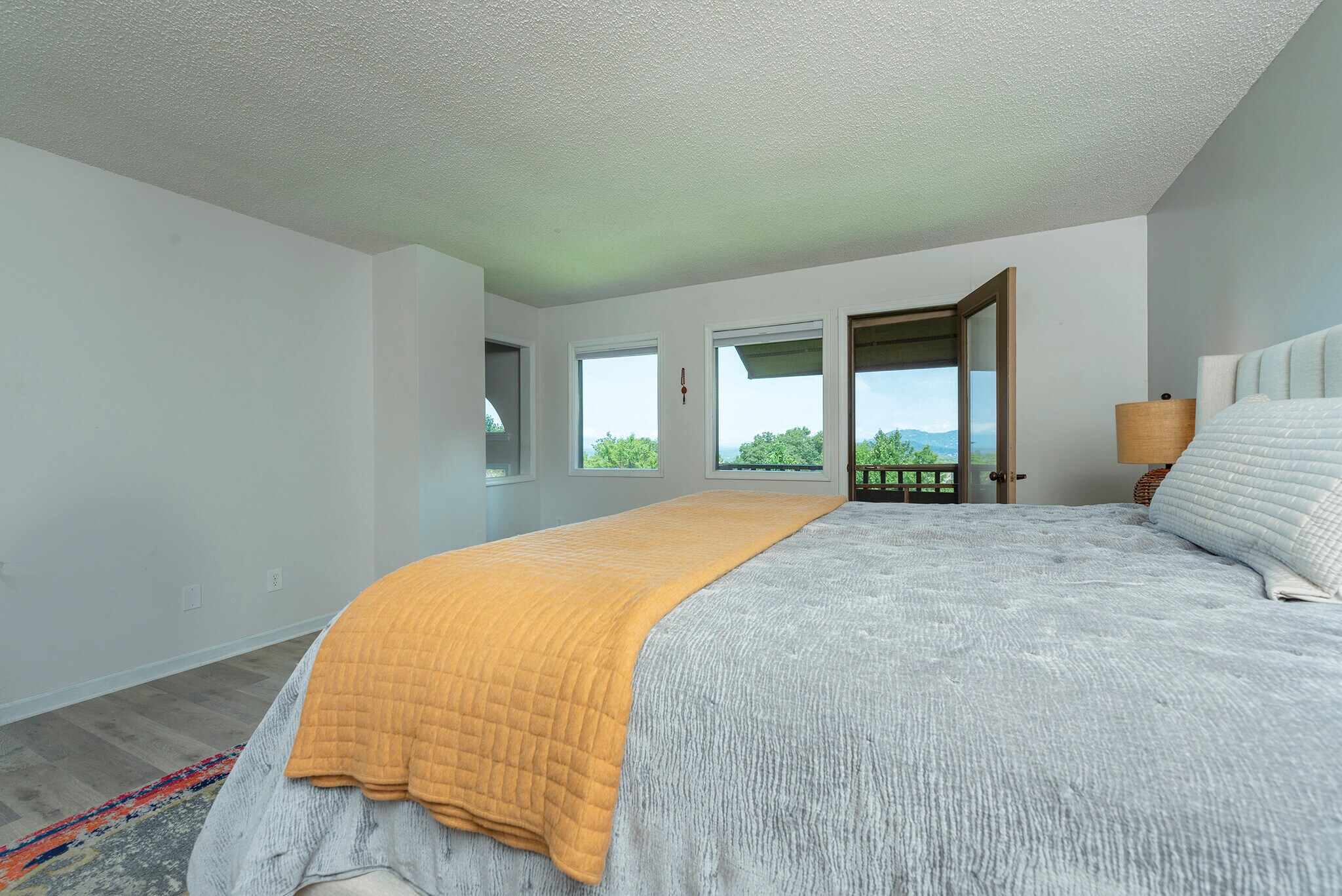 Secluded master bedroom sanctuary opening up to private, unobstructed mountain vistas. - 405 Windswept Dr