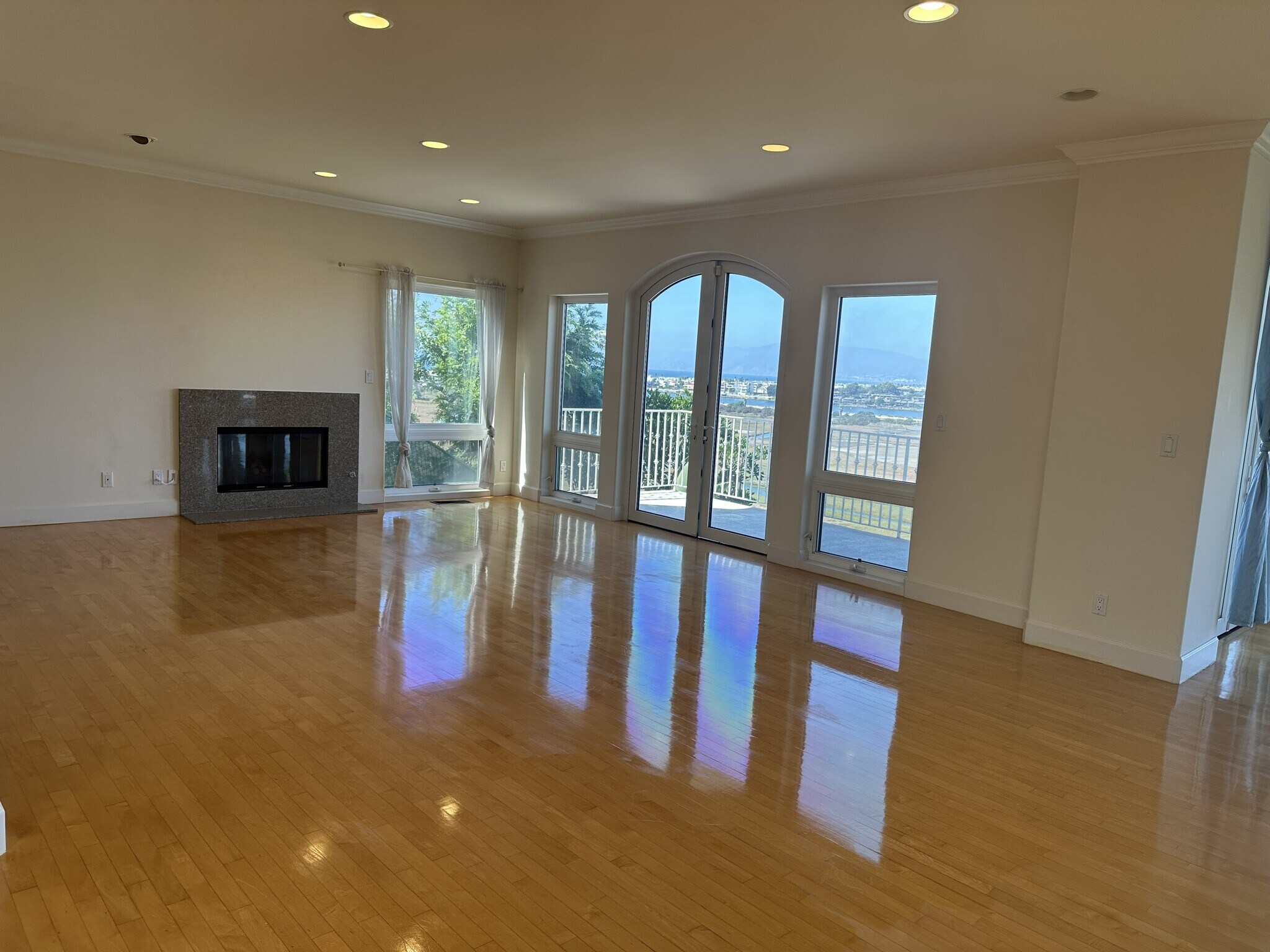 Expansive living room with gleaming floors, panoramic floor-to-ceiling windows - 8120 Billowvista Dr