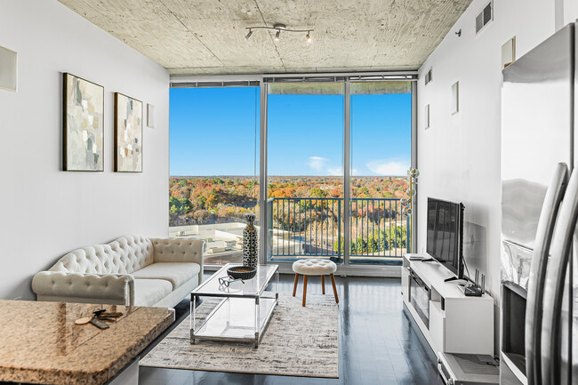 Spacious living room with floor to ceiling windows and breathtaking view - 361 17th St NW