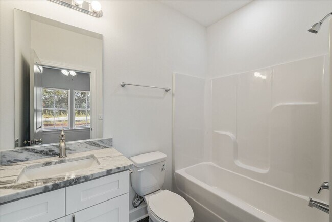 Building Photo - 5/5.5 Townhomes, Built 2024, Walk to stadium! Available August 2026!