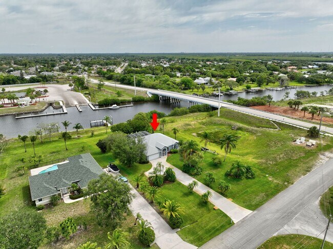 Building Photo - A BOATER'S PARADISE WITH THIS STUNNING 3 BEDROOM, 2 BATH WATERFRONT POOL HOME W/DOCK & BOAT LIFT ...