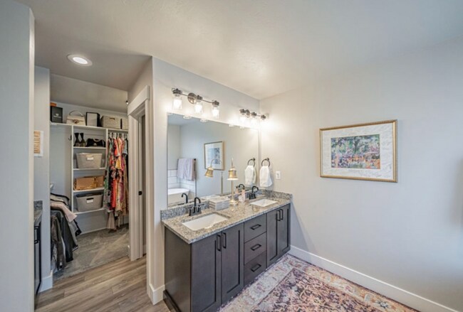 Building Photo - AWESOME END UNIT with attached 2 stall garage and additional personal parking spot on the exterior