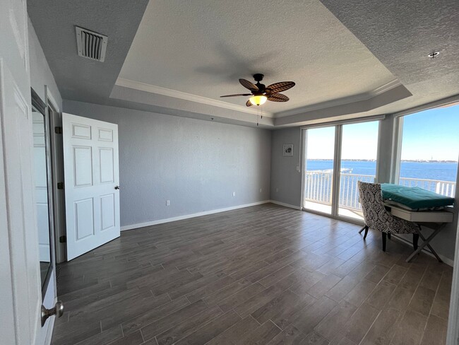 Building Photo - Beautiful waterfront condo in the gated co...