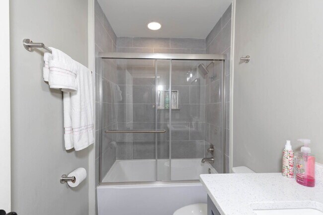 Building Photo - COMING SOON · Designer Renovation · Covered Deck Pavilion · 2-Car Garage · Lawn Care Included