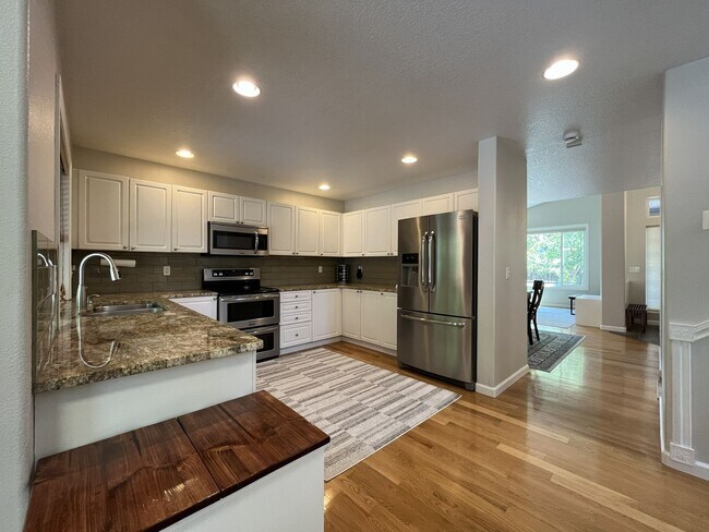 Building Photo - Spacious 3-Bedroom Home with Two Living Areas, Private Balcony, Fireplace & Attached 2-Car Garage