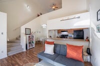 1BR, 2 BA - 840SF - Living Room - Lakepoint Commons