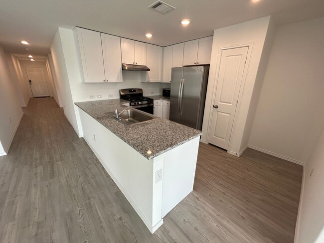 Building Photo - *MOVE IN SPECIAL* Modern 4-Bedroom Living with Community Pool Access!