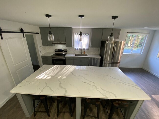 Building Photo - BRING YOUR ATVS - JUST MINUTES FROM THE OREGON DUNES!